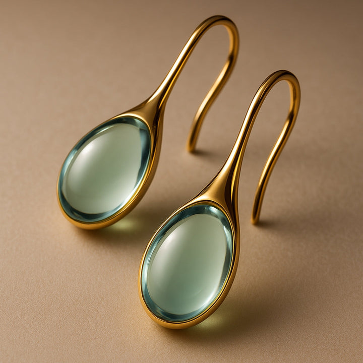 Hängende Kristallohrringe in Gold und Silber